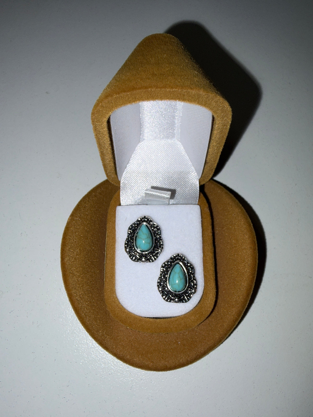 Earrings in a turquoise drop hat